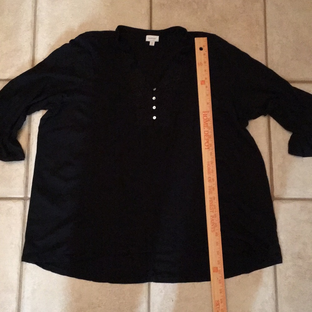 Black T-shirt, bell sleeves, button up at the top.